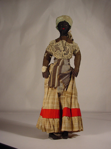 Doll, a black doll wearing fabric clothing. [Click here to open image in popup]